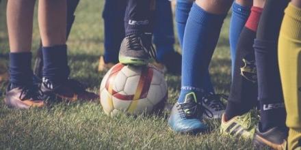 Football boots and ball