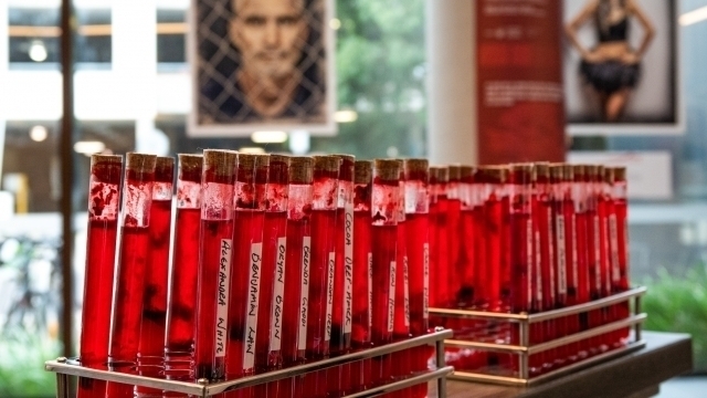 A close-up image of vials of fake blood as part of the We Bleed the Same Exhibition.