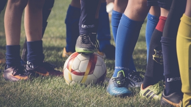 Football boots and ball