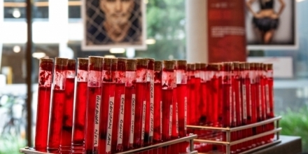 A close-up image of vials of fake blood as part of the We Bleed the Same Exhibition.