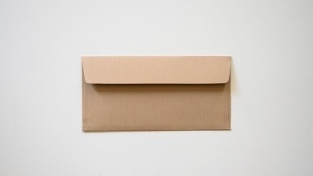 A brown envelope on white background